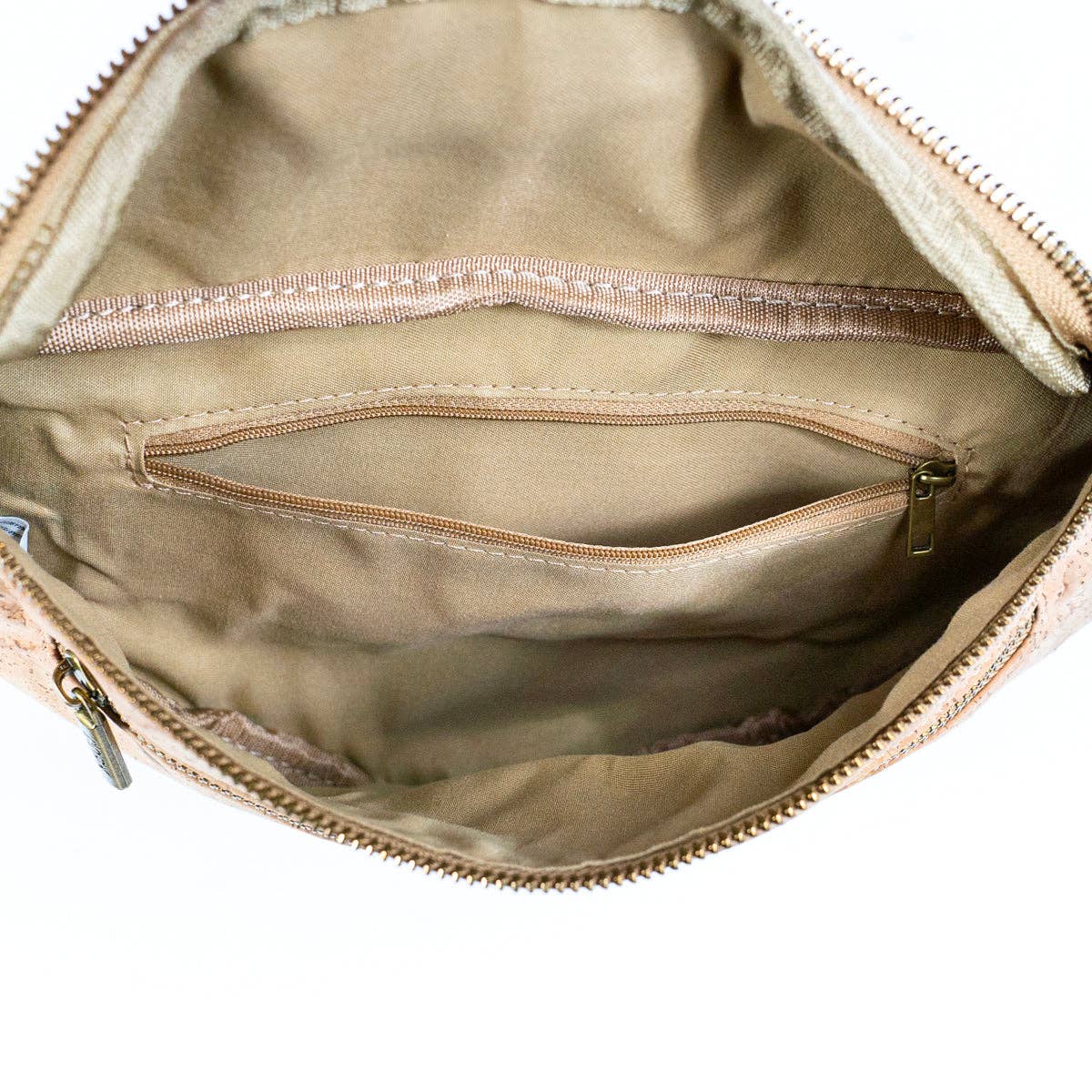 Eco-friendly cork sling bag open showing interior and pockets